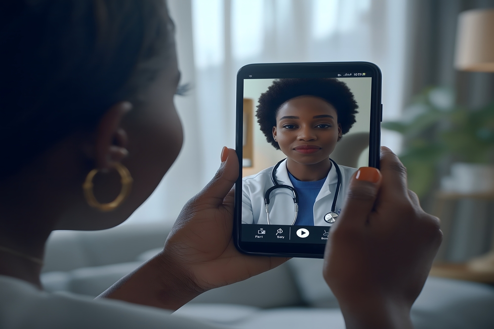 Woman having telehealth video appointment with her doctor smartphone 1